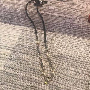 Necklace made of black felt. Delicate chains with tiny pearls and small cross